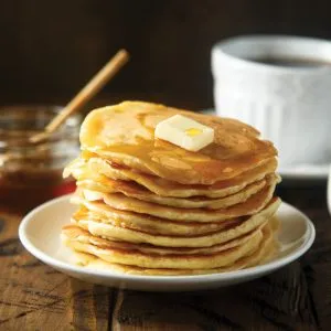 Stack of Organic Buttermilk Pancakes with Butter and Syrup