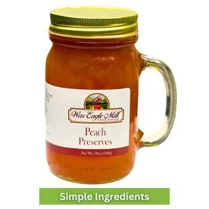 18 oz glass mug jar of War Eagle Mill Peach Preserves – made with simple ingredients for sweet, fruit-forward flavor.