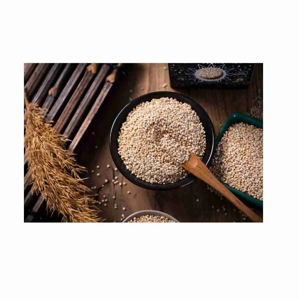 Bowl of uncooked quinoa with wooden spoon – Ancient Grain Recipe | War Eagle Mill